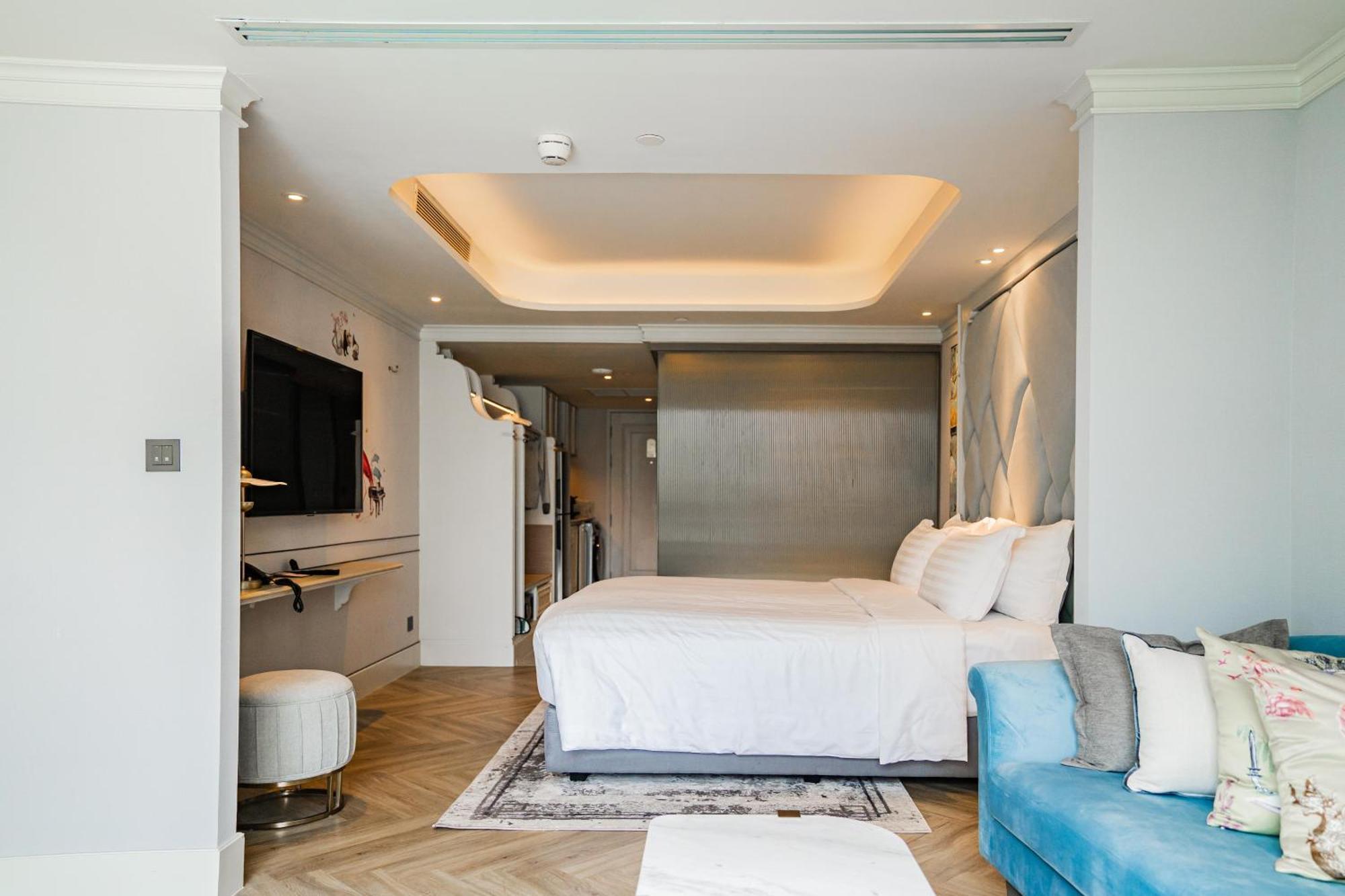 The Salil Hotel Riverside Bangkok Banguecoque Exterior foto A bedroom at the hotel